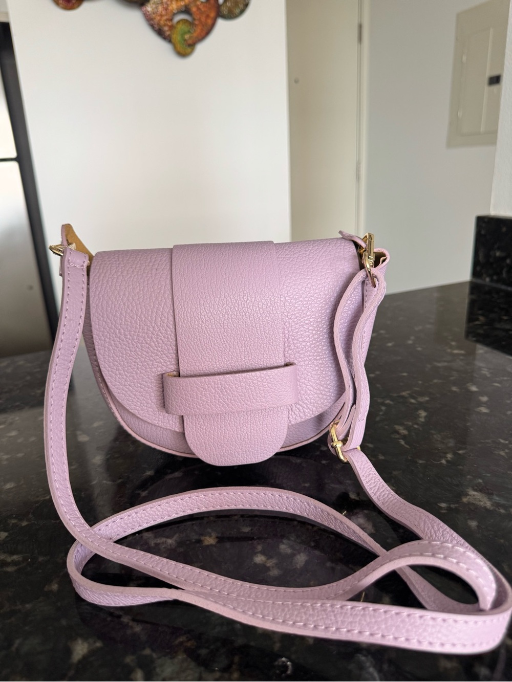 Lavender crossbody handbag.